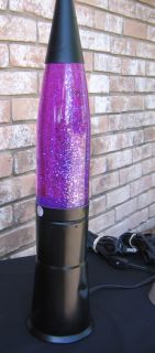 Lava Lamp Turned On with Glitter Flowing through Beautifully
