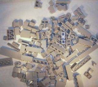 Up for sale is a lot of 126 Lego assorted light grey bricks, parts and