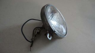 You are bidding on one used head light as shown. The chrome on the